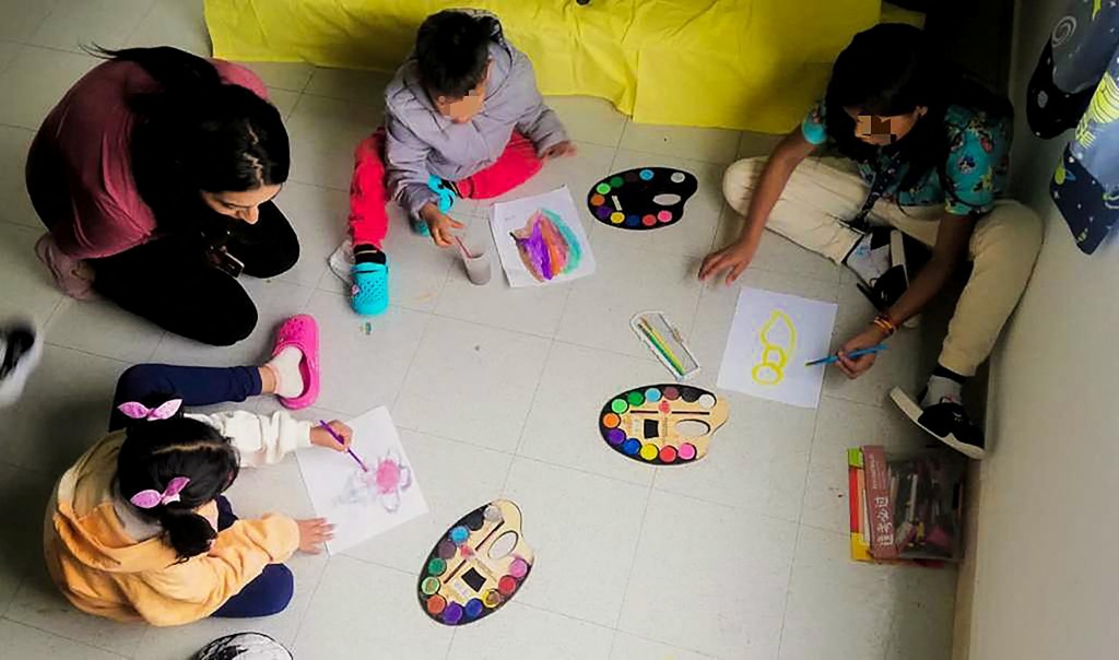 
Children from a Cessna 206 plane that crashed in thick jungle, play in a recovery center after being discharged from the Military Hospital in Bogota, Colombia.