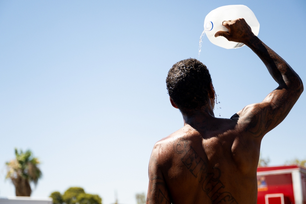 A Phoenix resident cools off amid searing heat in Phoenix, Arizona.