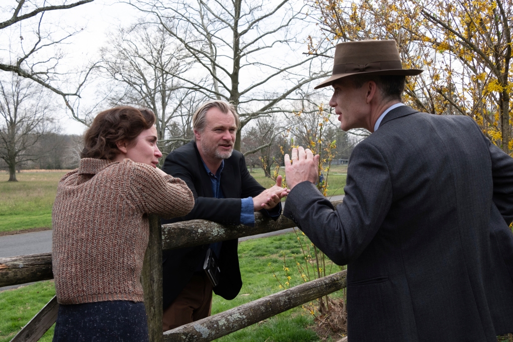 Christopher Nolan (center) directing Emily Blunt and Cillian Murphy. 