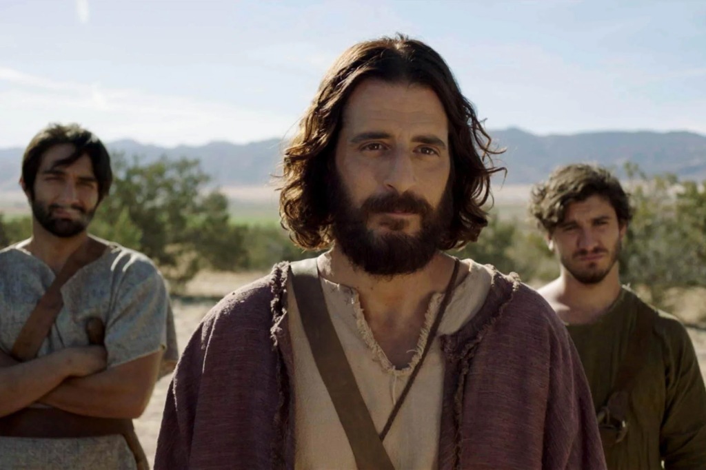 Jonatham Roumie as Jesus in "The Chosen" with two unidentified actors in the background. 