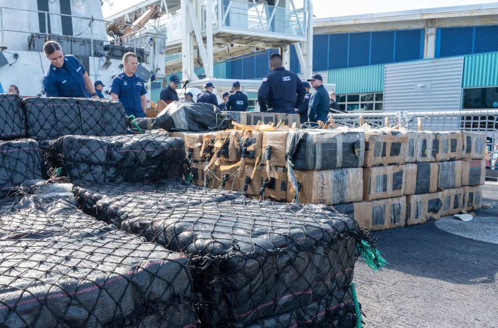 Coast guard members with seized drugs