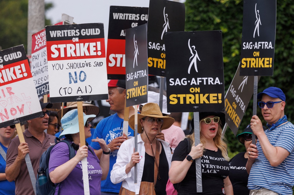 SAG-AFTRA actors and Writers Guild of America (WGA) writers walk the picket line in front of Paramount Studios in Los Angeles, California, U.S., July 17, 2023. 