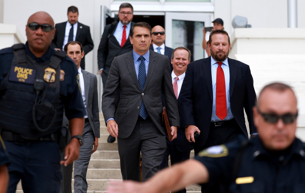 Attorneys for former President Donald Trump Todd Blanche (C) and Chris Kise (2nd R) leave The Alto Lee Adams Sr. United States Courthouse on July 18, 2023 in Fort Pierce, Florida.