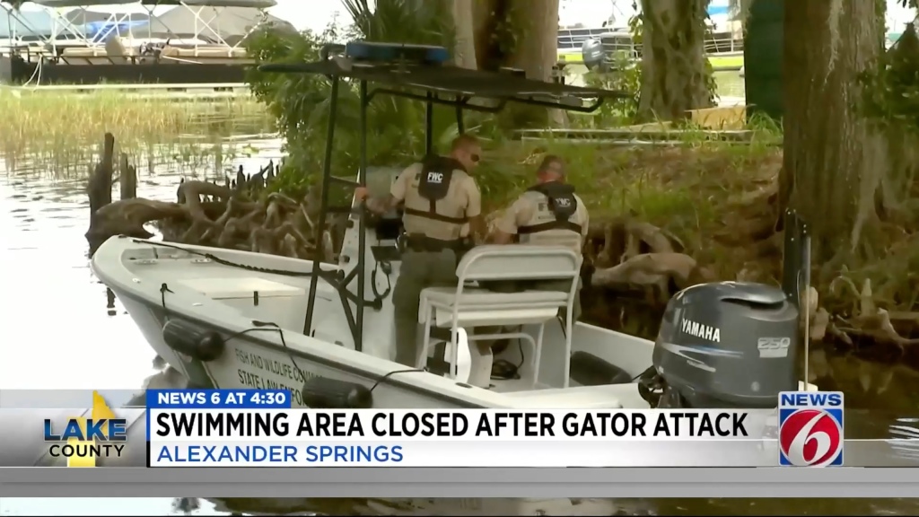 Officials on a boat near the spring.