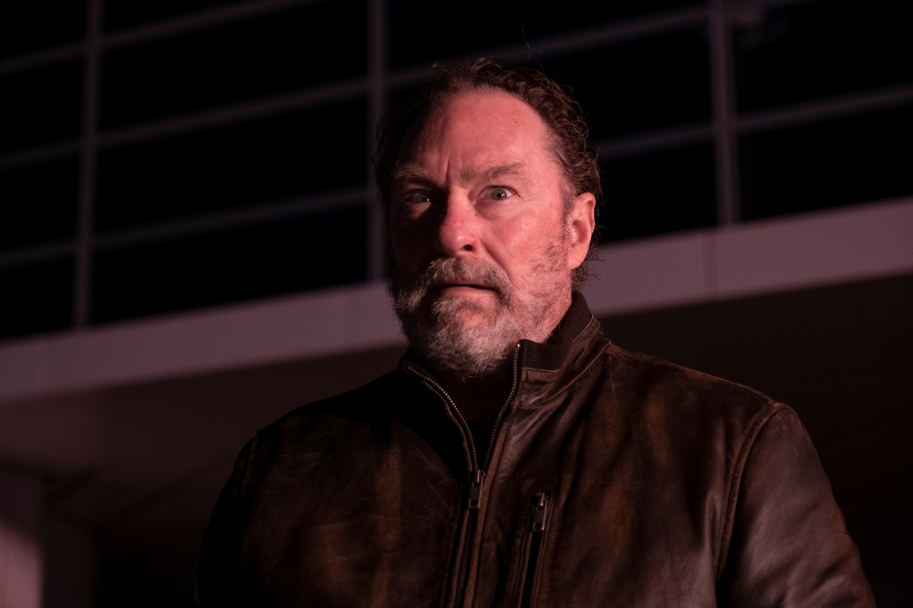 Stephen Root as Monroe Funches in "Barry." He's got a frightened look on his face. He's wearing a brown zip-up jacket and has a beard.