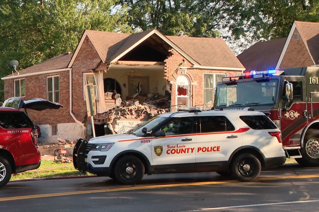 Front of home shows brick wall crumbled in the front. 