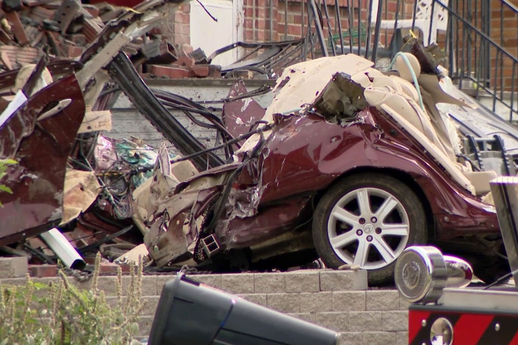 The crushed up car at the scene. 