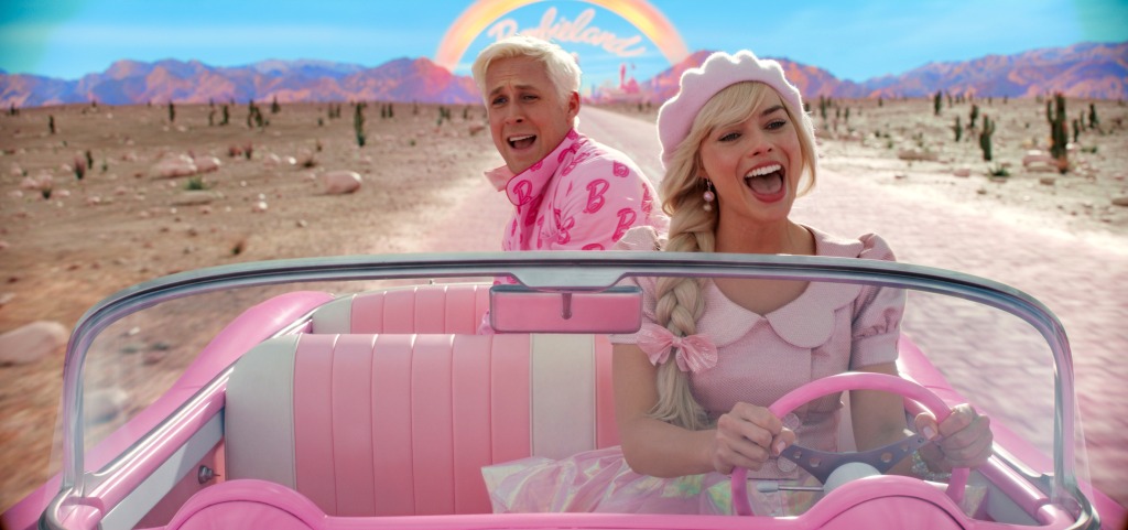 Margot Robbie and Ryan Gosling in the pink car in Barbieland
