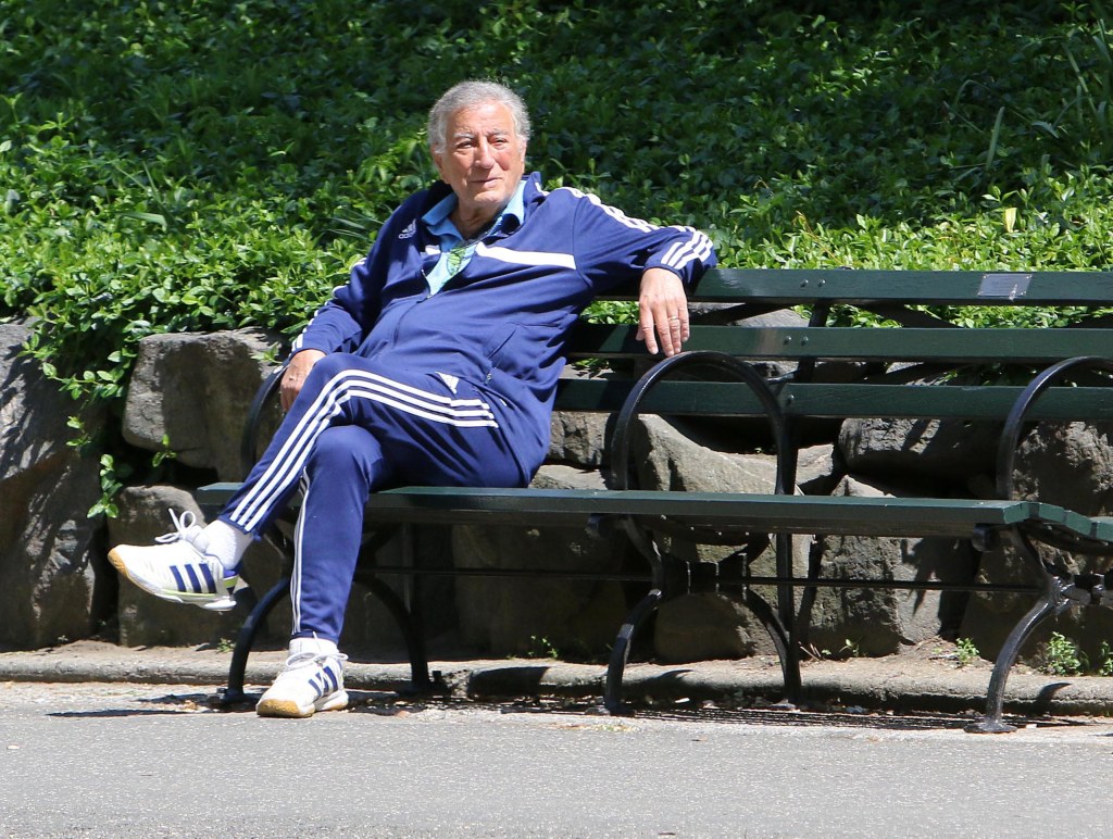 Tony Bennett sitting on a park bench in Central Park in 2016.