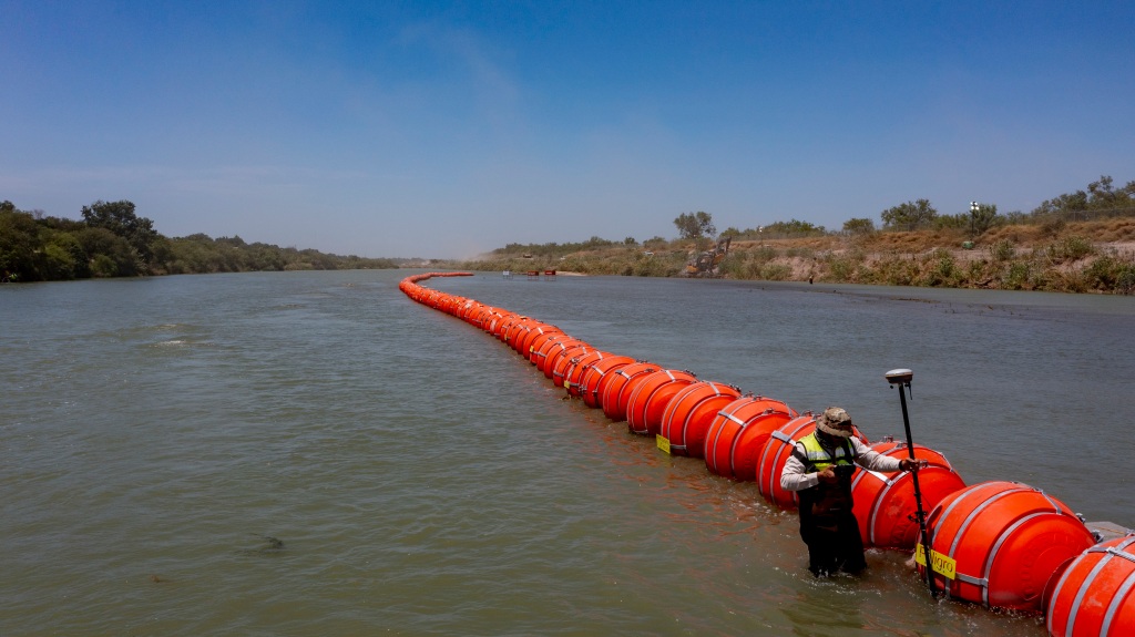 Buoys float on the Rio Grande River in Eagle Pass, Texas