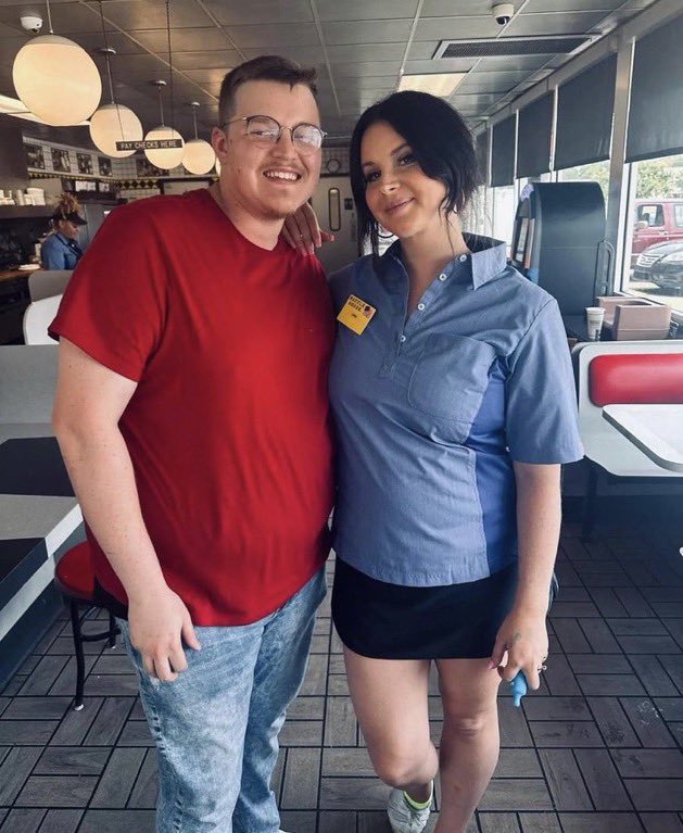 Lana Del Rey in uniform with fan