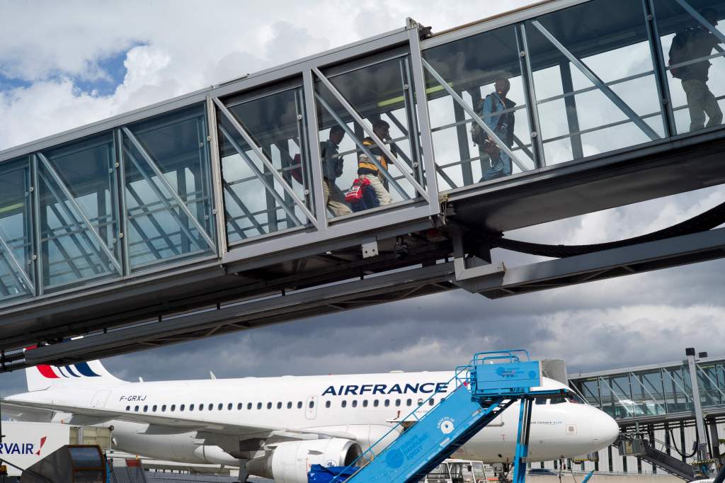 The American pilot was arrested at the Charles de Gaulle Airport in Paris. 