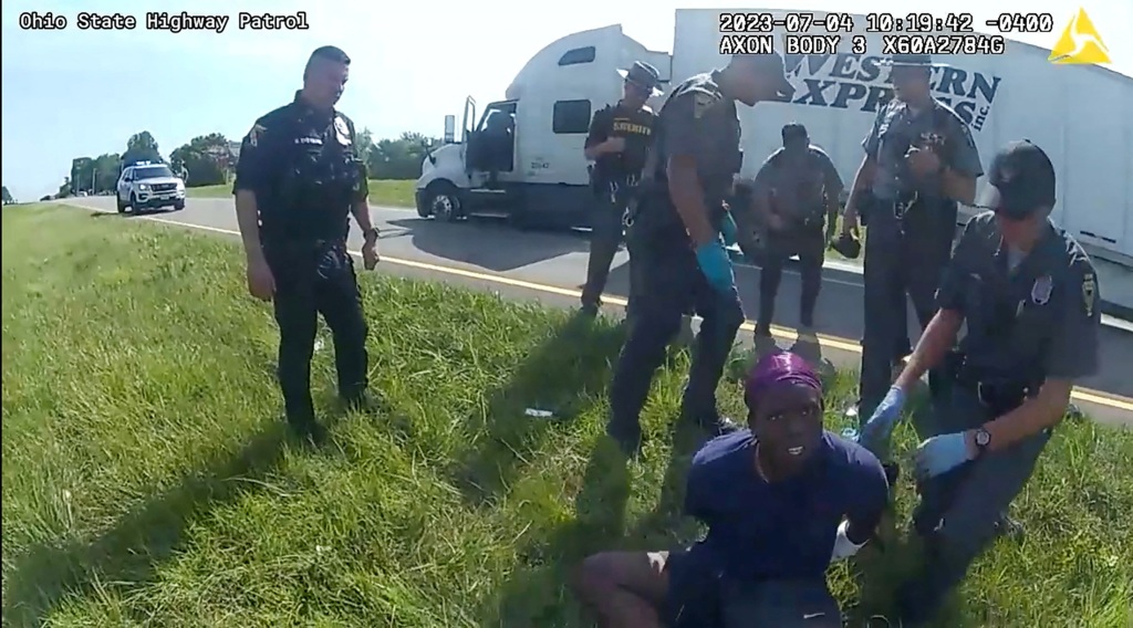 Truck driver Jadarrius Rose, 23, as he is taken into custody following the incident.