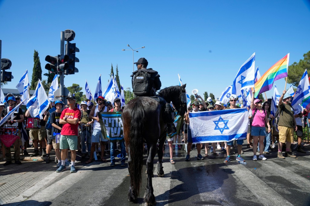 Israelis protest against Prime Minister Benjamin Netanyahu's judicial overhaul plan outside the parliament in Jerusalem.