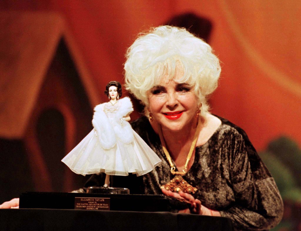 Elizabeth Taylor with a doll in her likeness