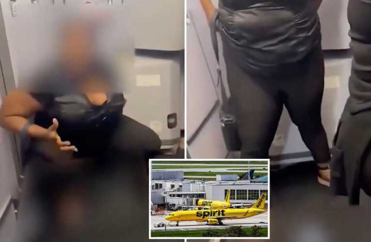 Woman caught on video peeing on floor of a Spirit plane