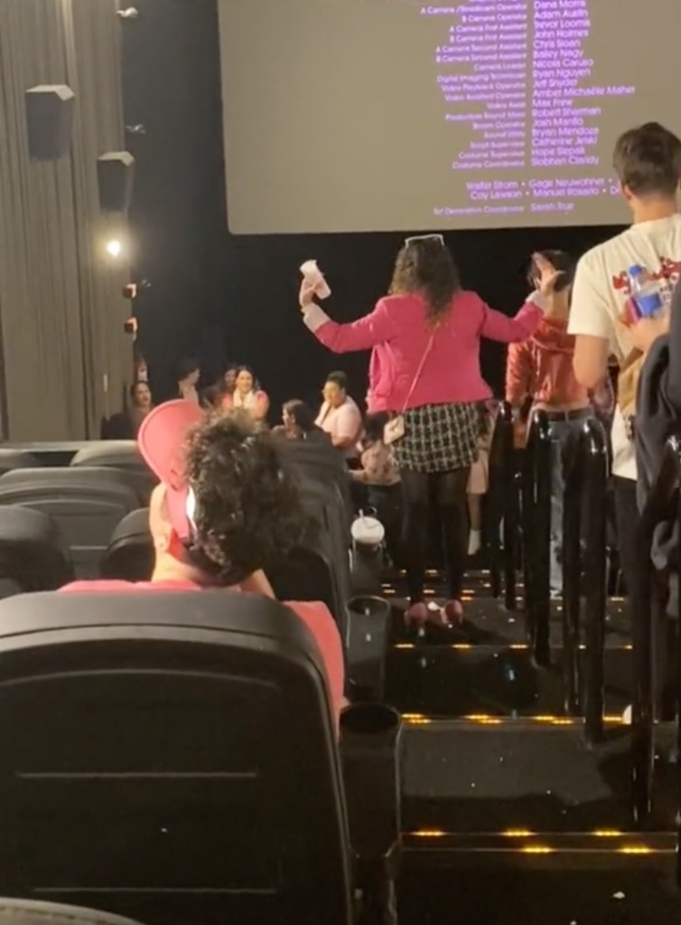 The video, which was posted Monday by TikTok user Sophia Ferreira, shows tons of pink-wearing fans angrily accosting the woman as the credits roll. 
