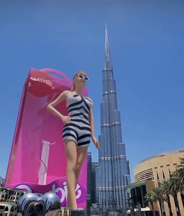 The doll then strikes a pose in front of Dubai's Burj Khalifa, which has been dubbed the "world's tallest building" standing at 2,722 ft.