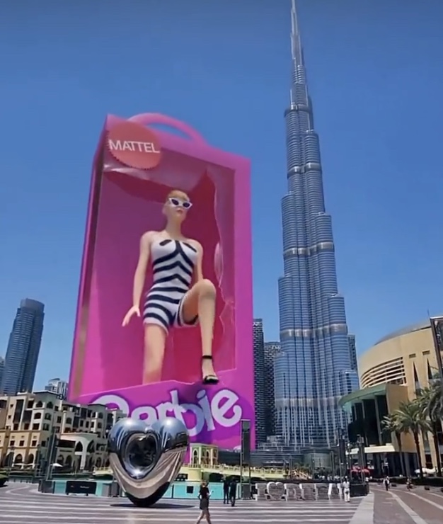 The virtual doll bares a striking resemblance to a teaser trailer released in December 2022 featuring Margot Robbie, who plays the title role, in the same suit.