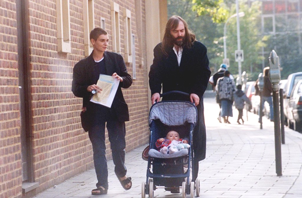  O’Connor embarked on a relationship with Irish journalist John Waters, with whom she welcomed daughter, Roisin, in 1996. They are pictured together before their acrimonious split. 