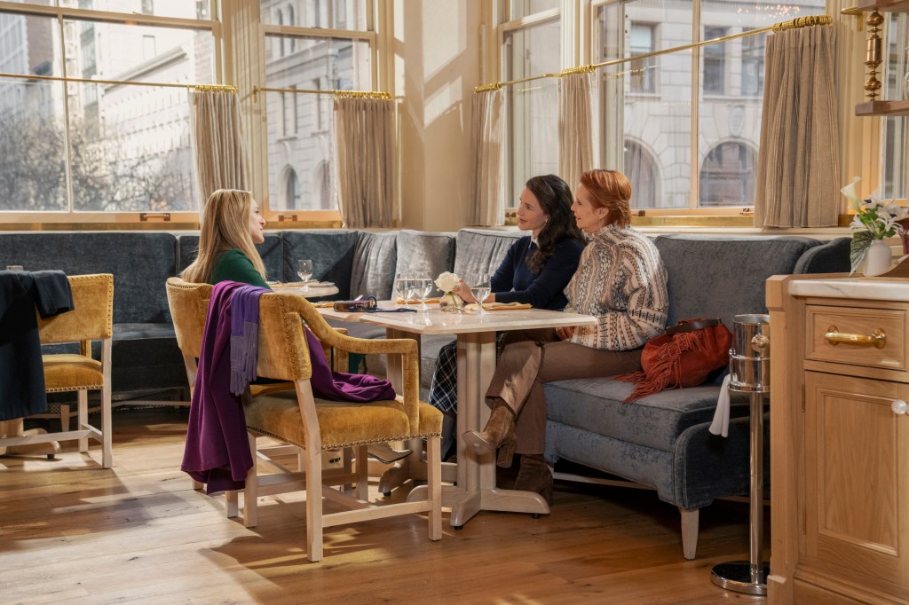 Carrie, Charlotte, and Miranda sit at a restaurant and talk about love.