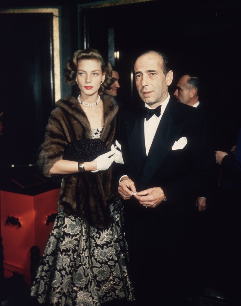 Humphrey Bogart and Lauren Bacall in black-tie attire.