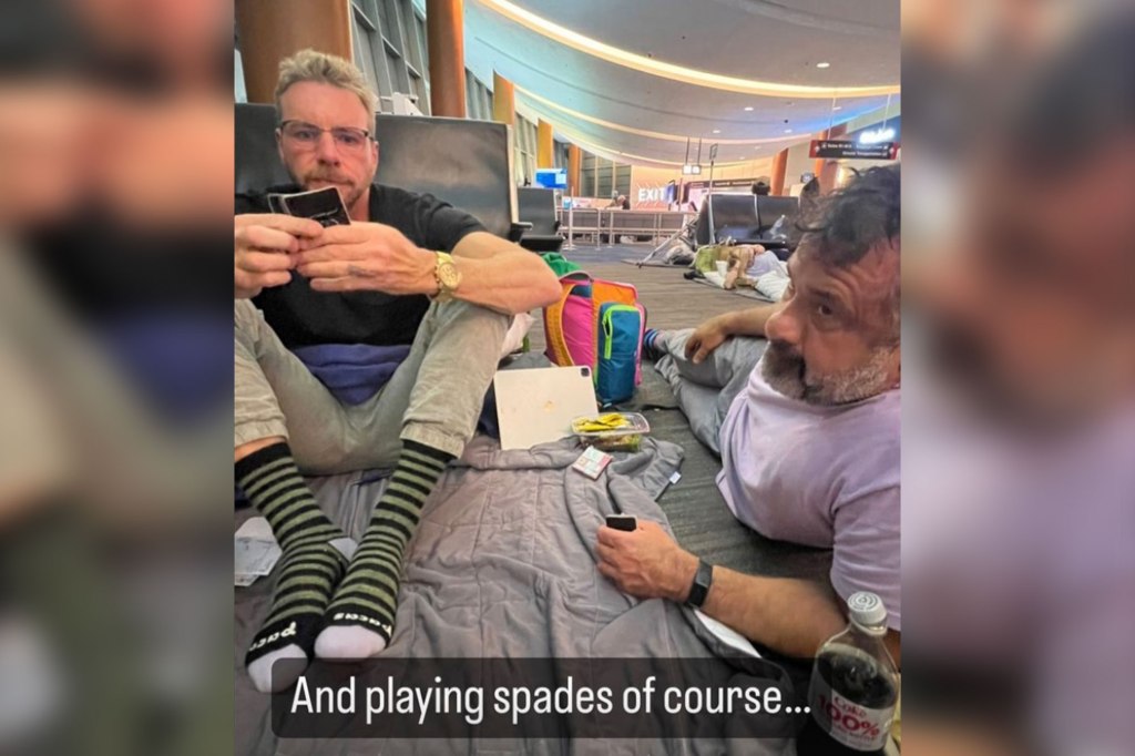 Dax Shepard and a friend play spades on floor of airport 