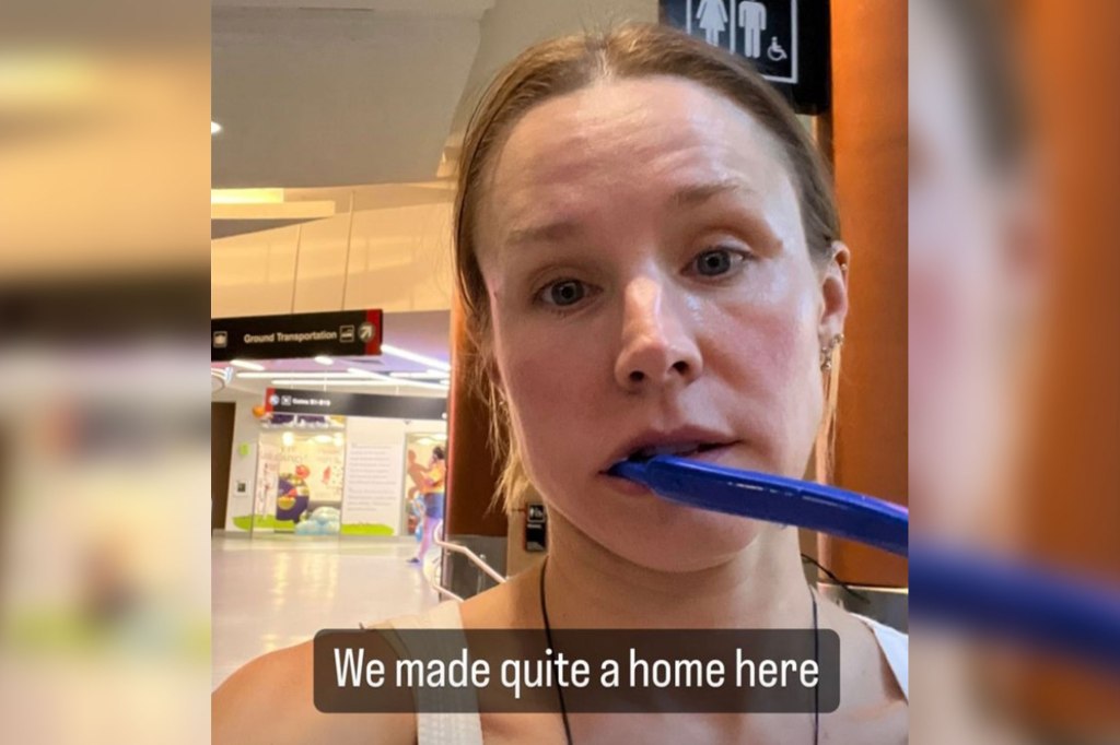 Kristen Bell takes a selfie with a blue toothbrush hanging out of her mouth with the caption "We made quite a home here."