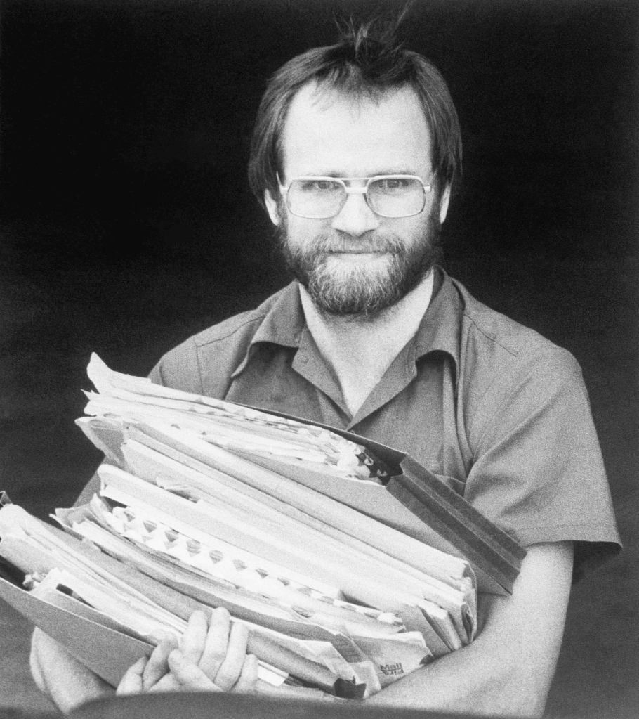 Lewis, who was a one-time leading suspect in the 1982 murders of seven people who swallowed tainted Tylenol, holds documents at federal court, June 5, 1984, in Kansas City, Mo.