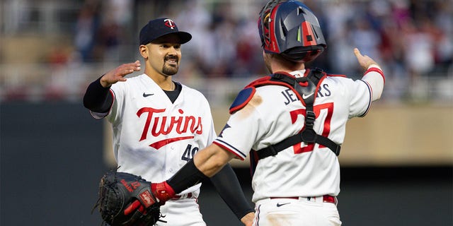 Pablo Lopez celebrates with Ryan Jeffers