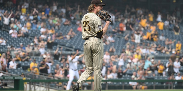 Tim Hill reacts after a throwing error