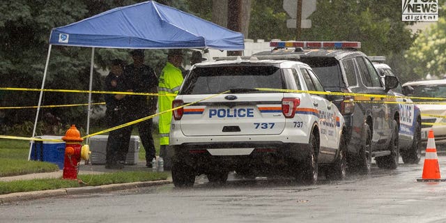 Authorities carry items out of Rex Heuermann's home in Massapequa Park