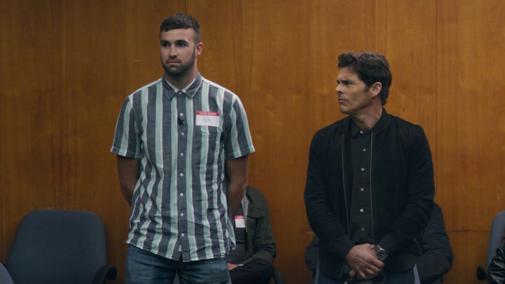 Ronald Gladden and James Marsden in a scene from the mockumentary "Jury Duty." They're standing in the jury box and Marsen is looking at Gladden, who's looking straight ahead.