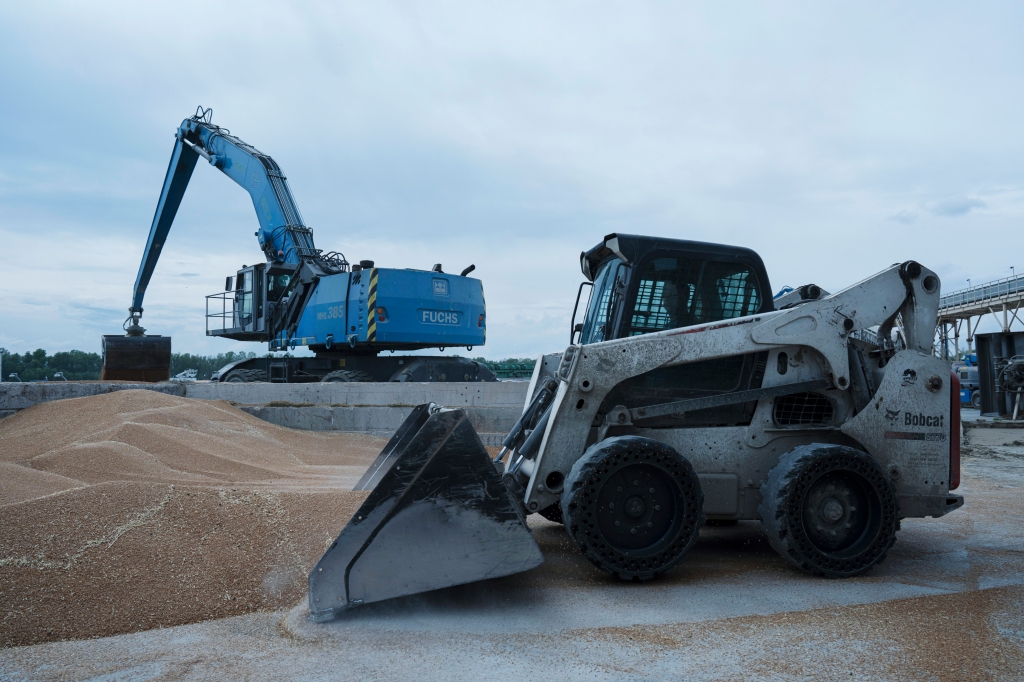 Excavators work at a grain port in Izmail, Ukraine, on April 26, 2023.