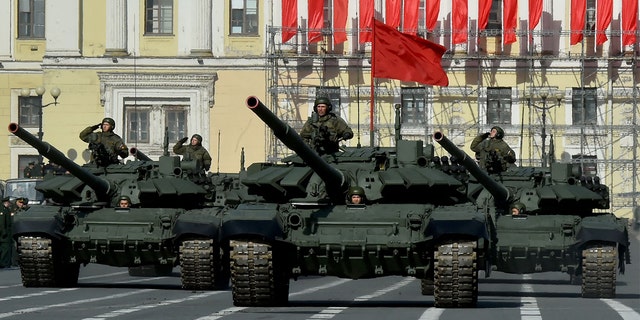 Russian military vehicles move on Dvortsovaya Square during a rehearsal for the Victory Day military parade in Saint Petersburg on April 28, 2022. Russia will celebrate the 77th anniversary of the 1945 victory over Nazi Germany on May 9. (Photo by OLGA MALTSEVA/AFP via Getty Images)