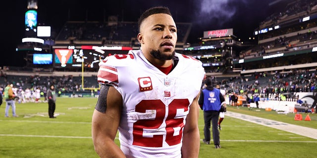 Saquon Barkley walks on field