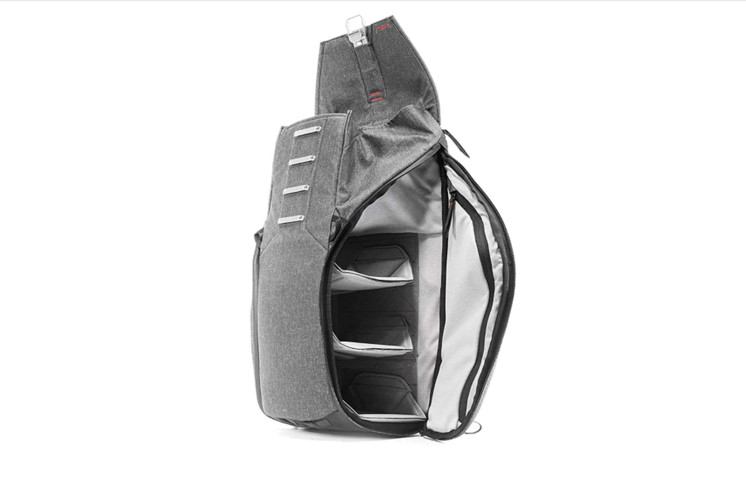 Gray backpack showing open side pocket.