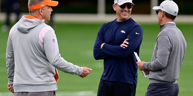 Sean Payton talks with execs