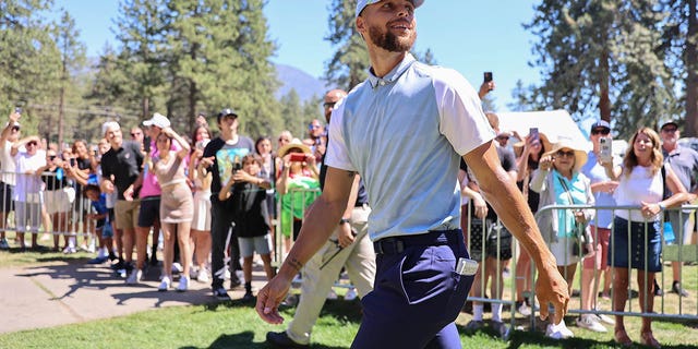 Steph Curry walks the court