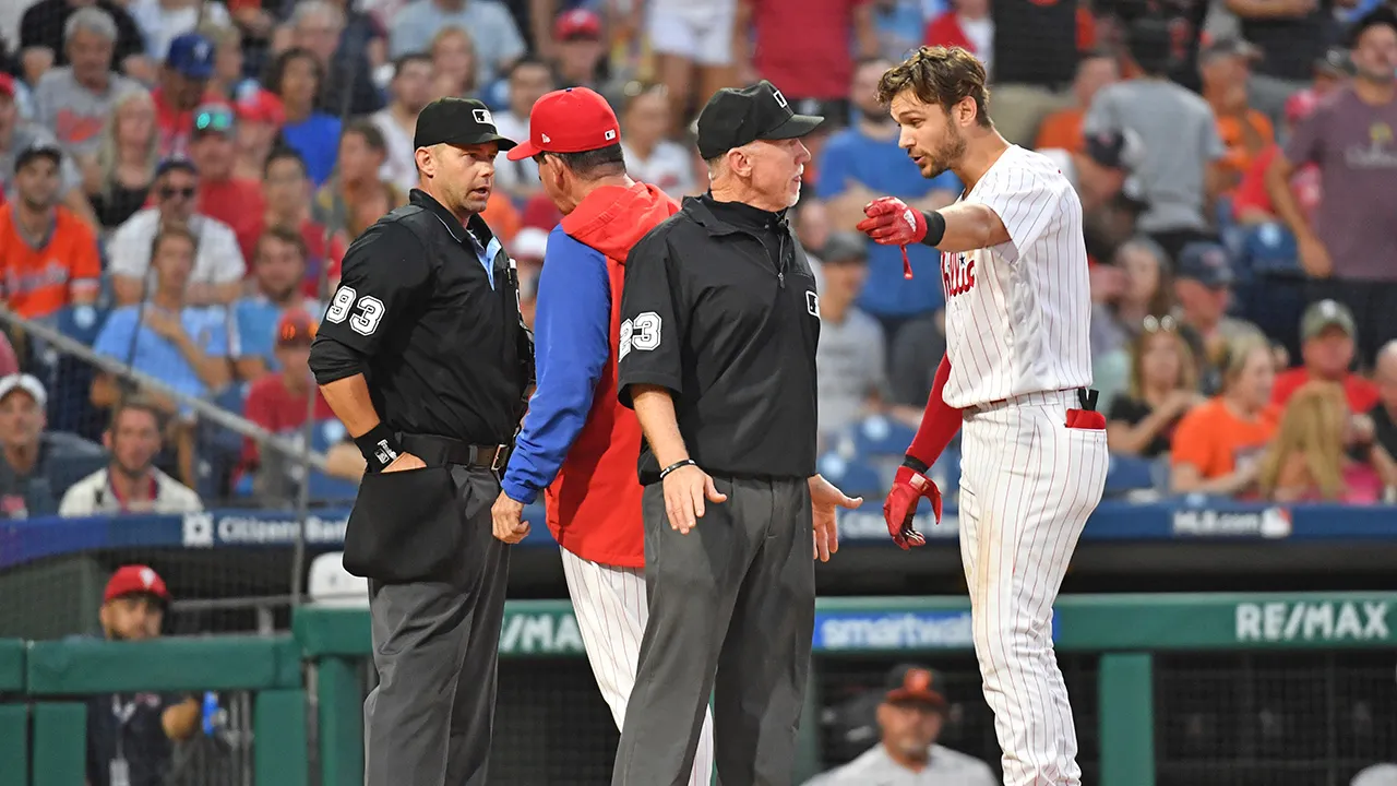 Trea Turner argues with umpires