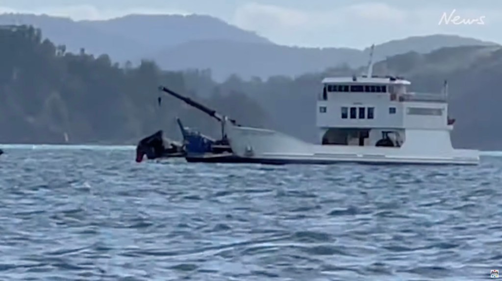 Wreckage being pulled up from the water of the crashed army helicopter.