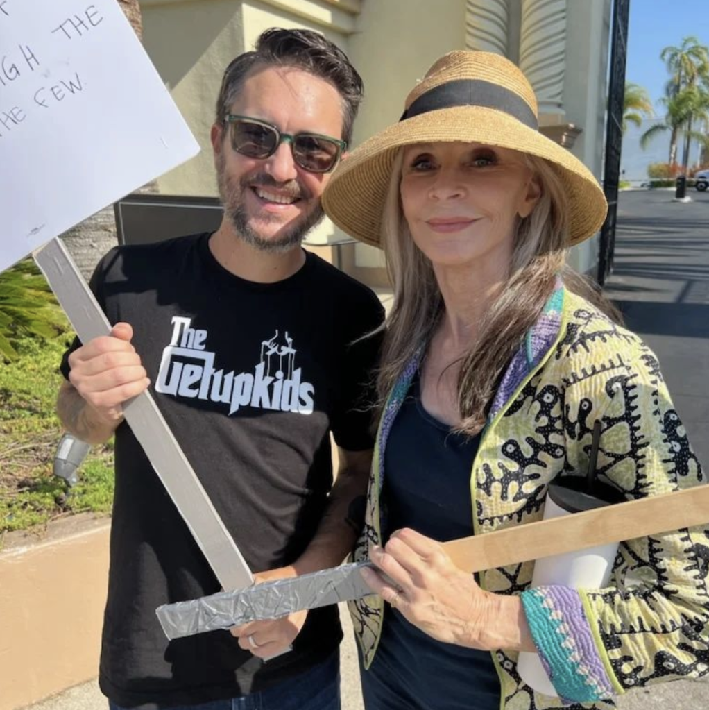 Wil Wheaton shared a post on Instagram of him holding picket signs with actress Cheryl Gates McFadden. 