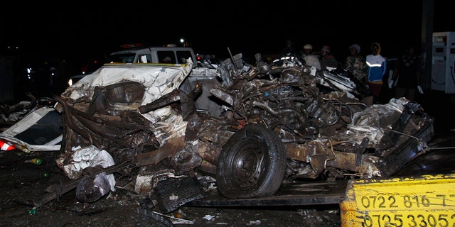 A mangled mass of steel lays at the site of a fatal collision in Kenya