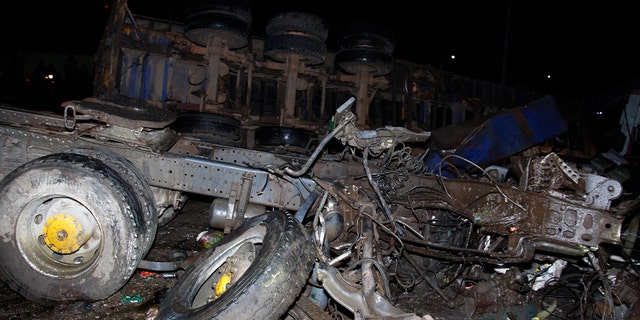 The wreckage of vehicles lies on the ground after a fatal accident in Londiani, Kenya