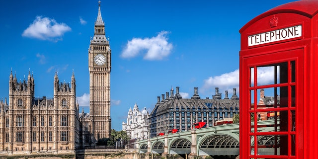 Houses of Parliament in background, red phone box at foreground right