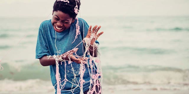 Kid covered in Silly String