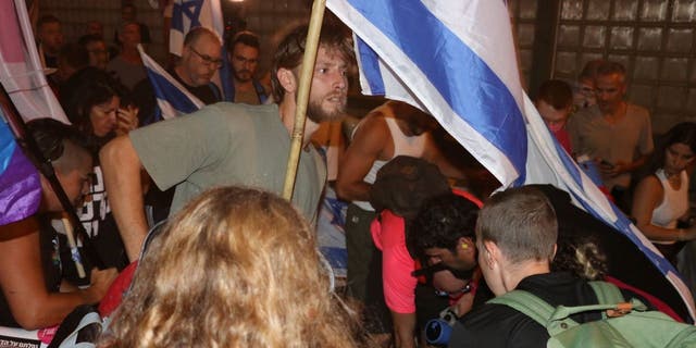 Man waving Israeli flag