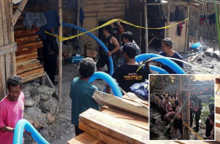 Indonesia rescuers try to reach 8 workers trapped in an illegal mining hole