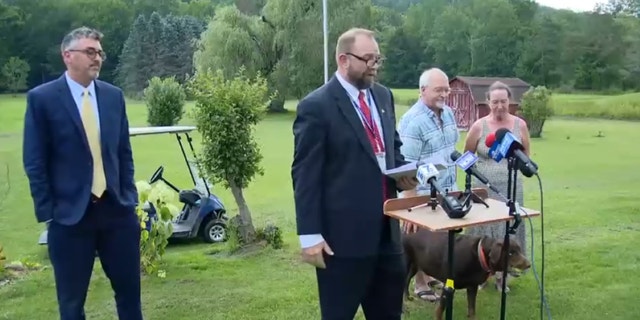 Ecklund couple and AG at presser