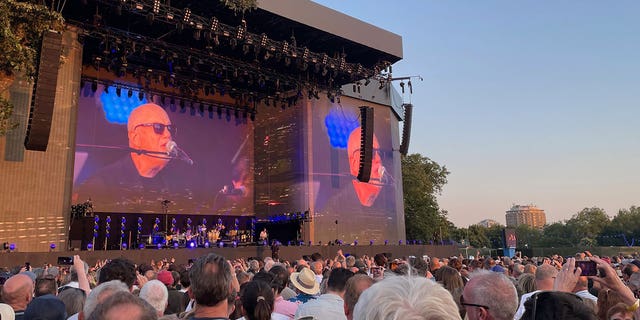 Billy Joel performs on piano on stage